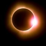 Solar eclipse featuring a diamond ring effect and baileys beads